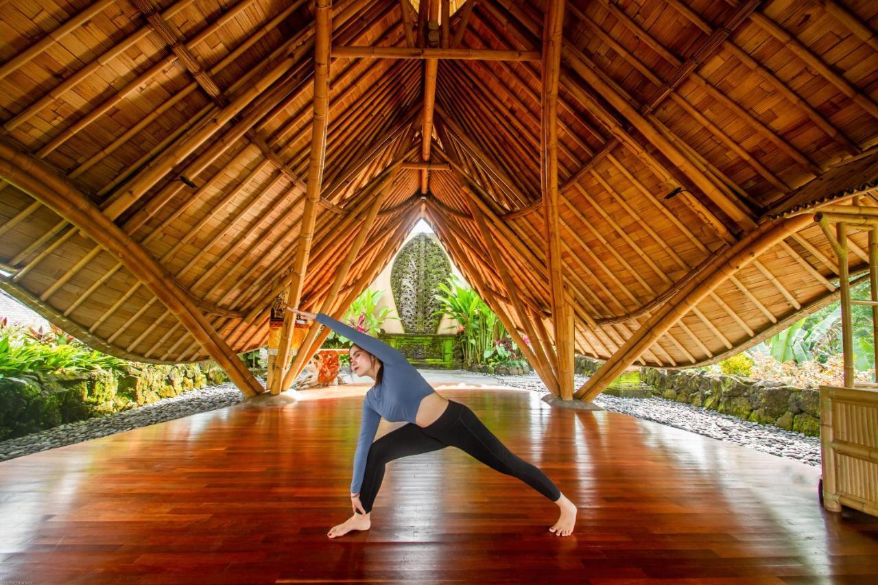 Weda Cita Resort And Spa By Mahaputra Ubud Exterior foto A woman practicing yoga at the Four Seasons Resort Maui